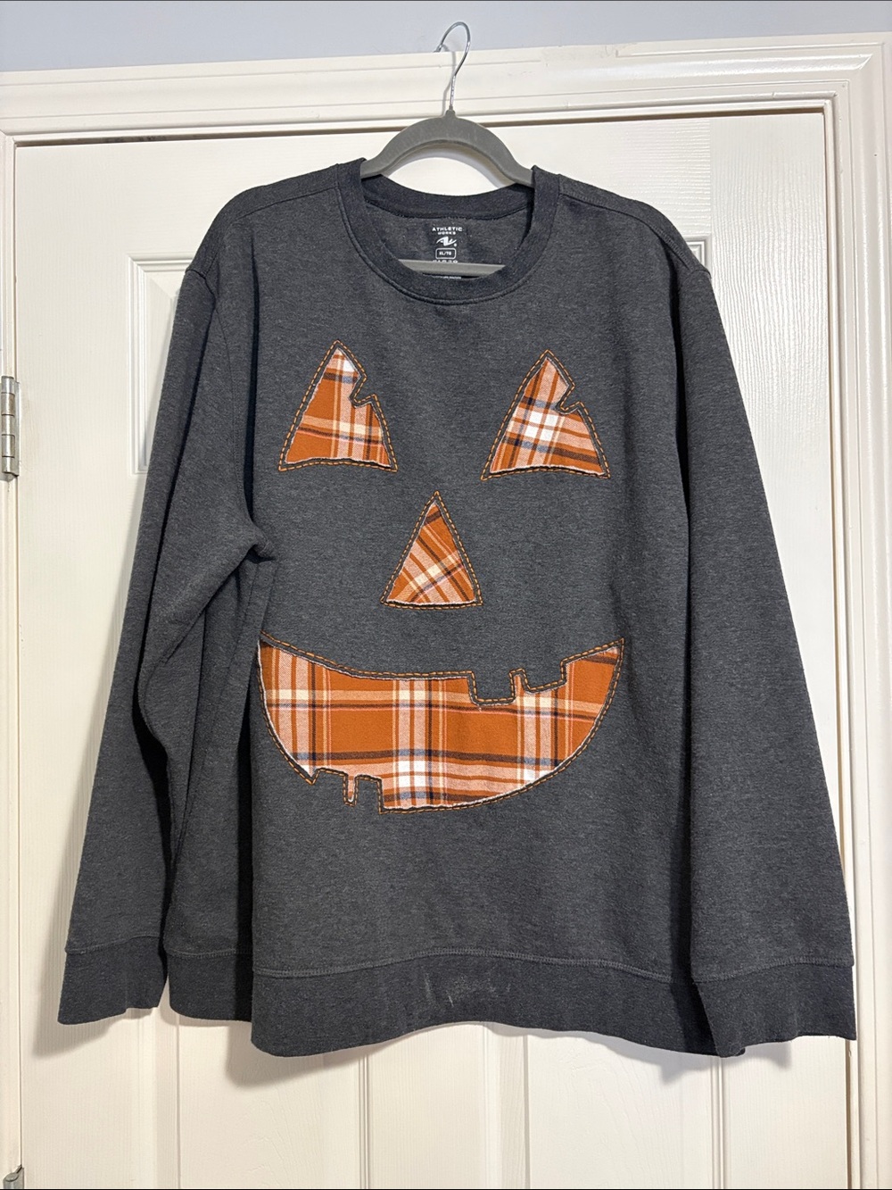 Hand made crewneck with pumpkin face cutout